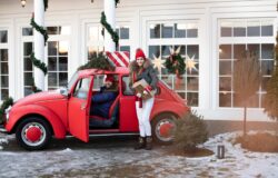 beautiful-caucasian-girl-warm-winter-clothes-carries-boxes-with-christmas-gifts-red-car-her-husband_132075-6469